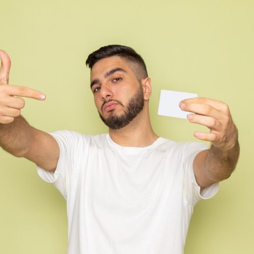 front-view-young-male-white-t-shirt-holding-white-card_140725-28158